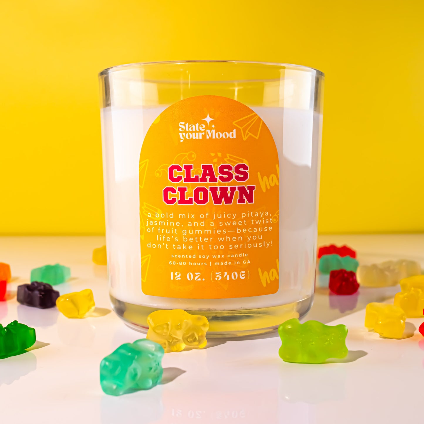 class clown soy wax candle in clear recyclable jar with bright, playful label design